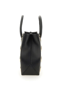 Moschino women’s black leather handbag with gold-tone circular studs and top handles for stylish carrying