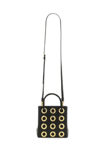 Moschino women’s black leather mini tote bag with gold-tone circular studs and matching top handle
