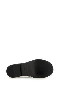 Moschino women’s Mary Jane Olivia black shoe with a smooth glossy black rubber sole and subtle branding near the heel