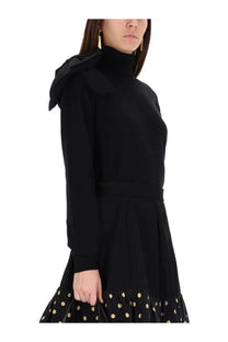 Moschino women’s mesh black high-neck dress with ruffled hood long sleeves and gold polka dots on skirt