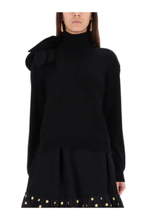 Moschino women’s black mesh high-neck sweater with large decorative bow on the shoulder
