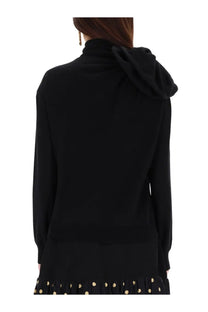 Moschino women’s mesh black hooded sweater with soft ribbed texture and long sleeves front view