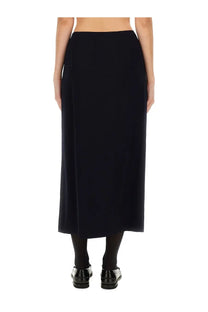 Moschino women’s black midi skirt with straight cut smooth fabric and subtle side slit for stylish wear