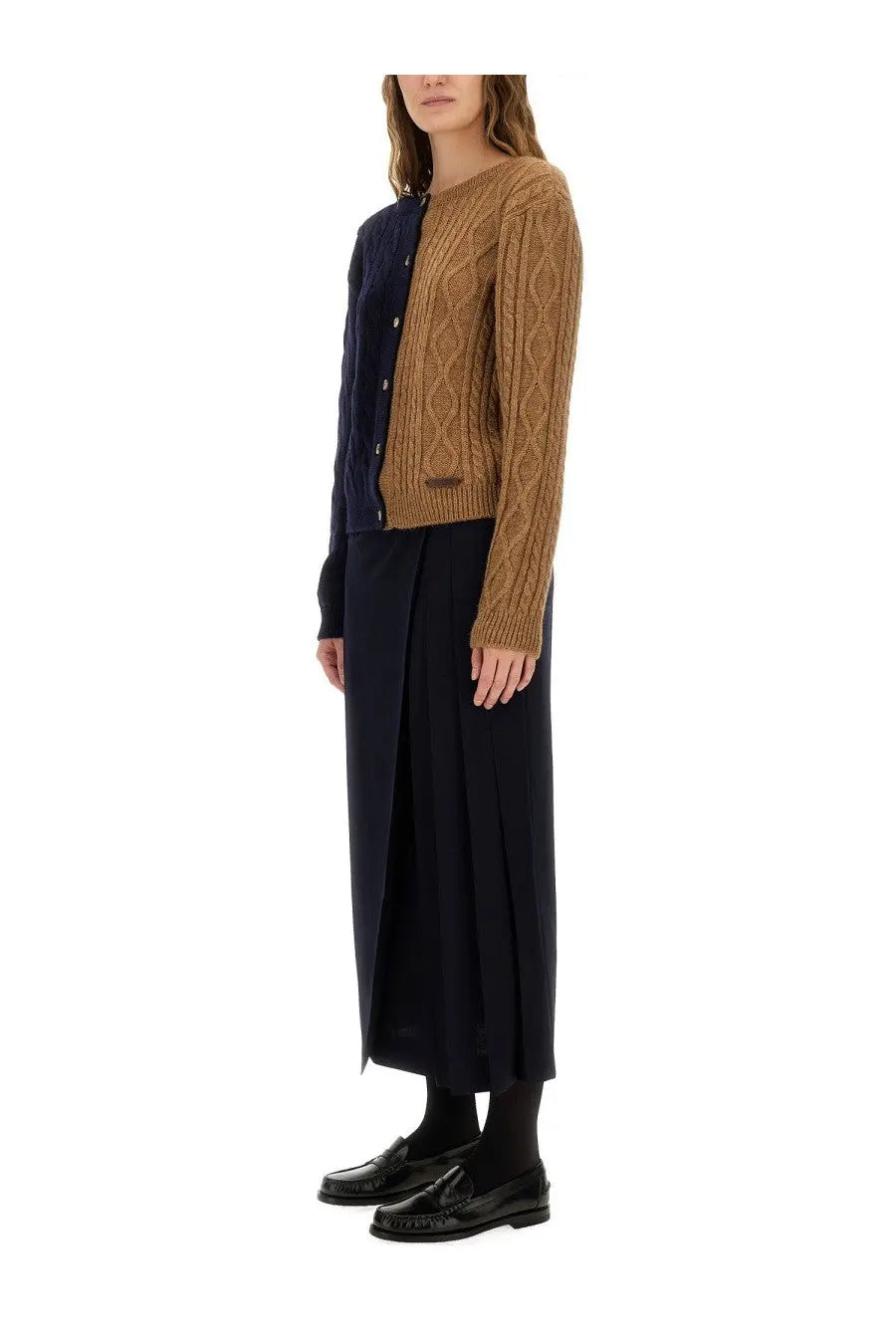 Moschino women’s midi skirt blue shown with a two-tone navy and camel cable knit cardigan on the front side