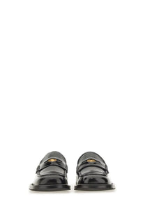 Moschino women’s moccasin berlin black patent leather loafers with gold-tone medusa head logo front view