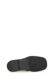 Black rubber sole with textured grip and embossed Moschino logo on Moschino women’s moccasin Berlin black