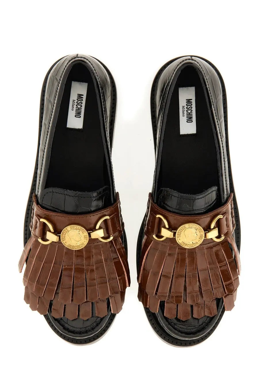 Brown fringed leather slip-on sandals with gold tone coin and buckle accents and a black croc embossed sole by moschino