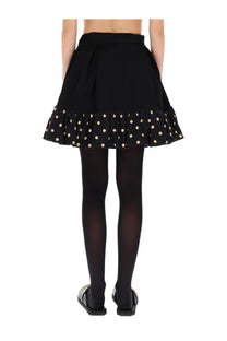 Moschino women’s black mini skirt with gold polka dots flared hem and delicate ruffles