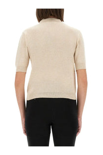 Beige short-sleeved knit polo shirt with collar and ribbed cuffs by Moschino for women