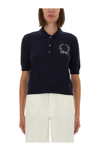 Moschino women’s navy blue knit polo shirt with white embroidered laurel wreath on left chest
