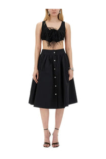 Moschino women’s black poplin skirt set featuring a button-front skirt and black feathered crop top