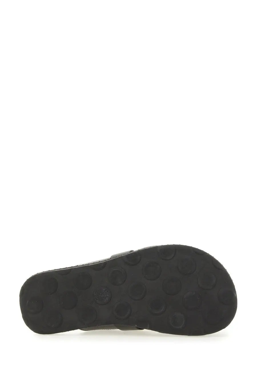 Black rubber sole with circular tread pattern of moschino women’s sabot black shoe back side view