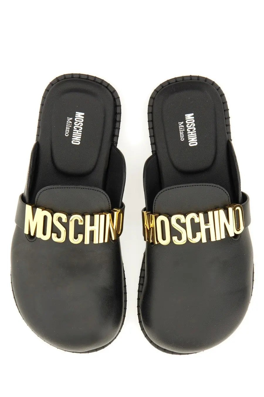 Moschino women’s sabot black slip-on leather mules with gold-tone lettering across the front for stylish wear