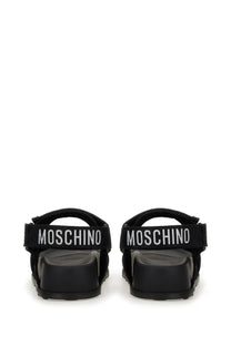 Moschino women’s black sandals with chunky sole and white embroidered logo band on the front side