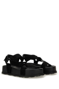Moschino women’s black platform sandals with suede look chunky sole and crisscross strap design