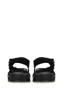 Moschino women’s sandal black with black suede look straps and chunky rubber sole front view