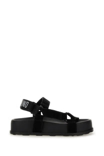 Moschino women’s black velvet platform sandal with bold chunky sole and adjustable straps featuring brand name