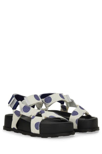 Moschino women’s white platform sandals with purple polka dots and black rubber soles front view