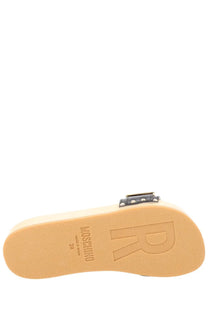 Moschino women’s beige platform slide sandal with black studded buckle and embossed branding on the sole