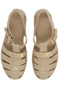 Moschino women’s beige sandalo jelly sandals with glossy translucent material and gold tone lettering on the footbed
