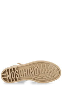 Beige moschino women’s sandalo jelly shoe sole with embossed logo and textured tread pattern visible from the back side