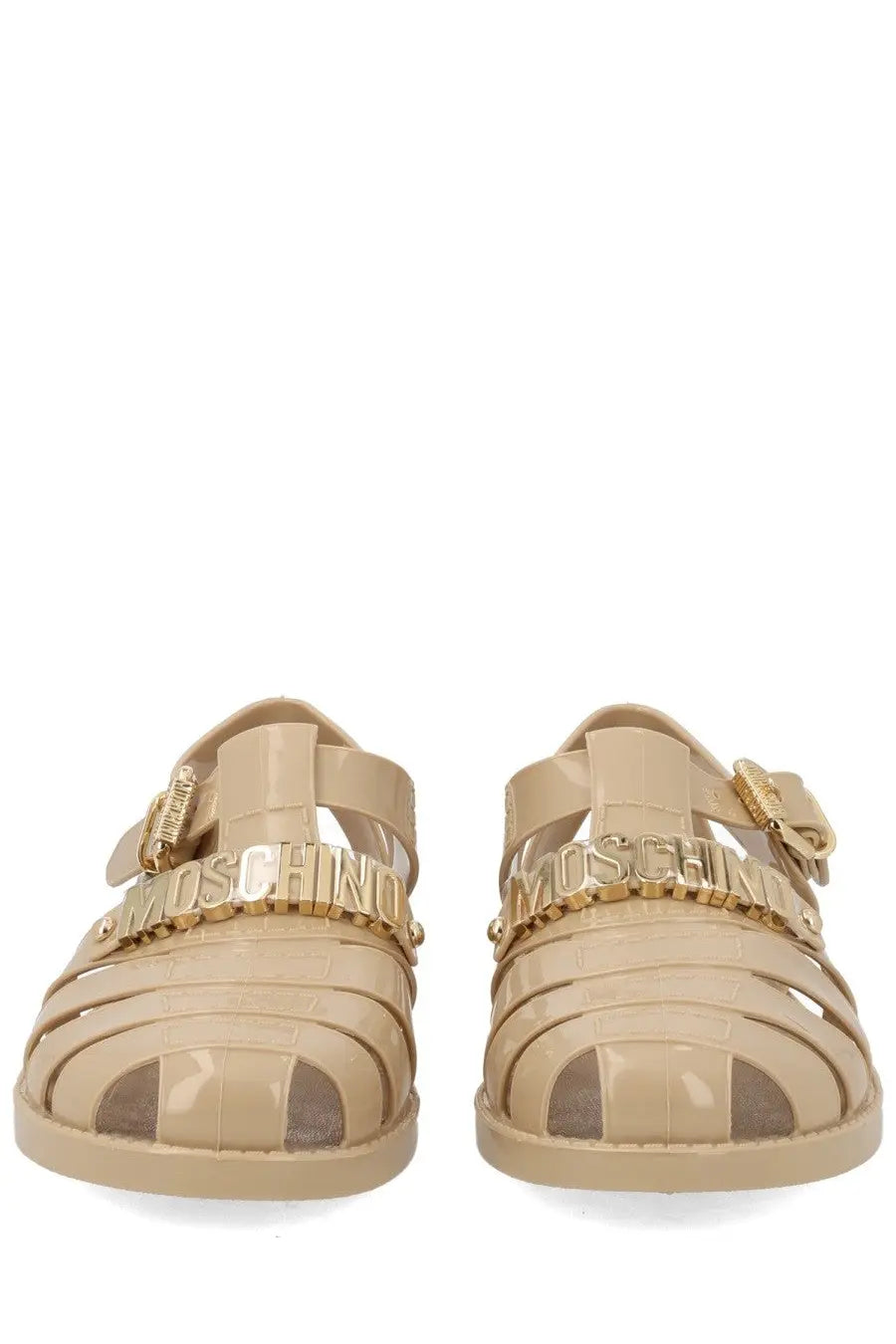Beige translucent rubber sandals with gold-tone Moschino lettering across the foot strap for women