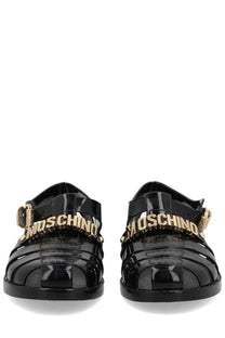 Moschino women’s sandalo jelly black glossy rubber sandals with gold-tone lettering and buckle details