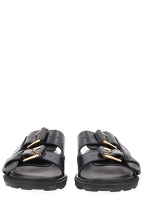 Moschino women’s sandalo tie black leather sandals with dual gold-tone buckle straps and chunky rubber sole