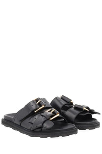 Moschino women’s sandalo tie black leather sandals with gold-tone buckle straps and chunky rubber sole