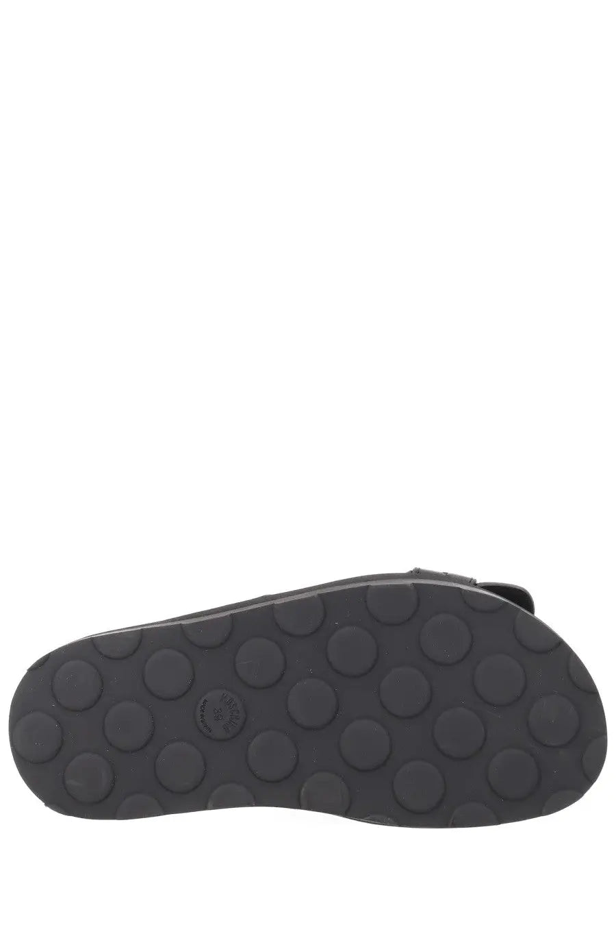 Black rubber sole with circular tread pattern on the back of moschino women’s sandalo tie black sandal