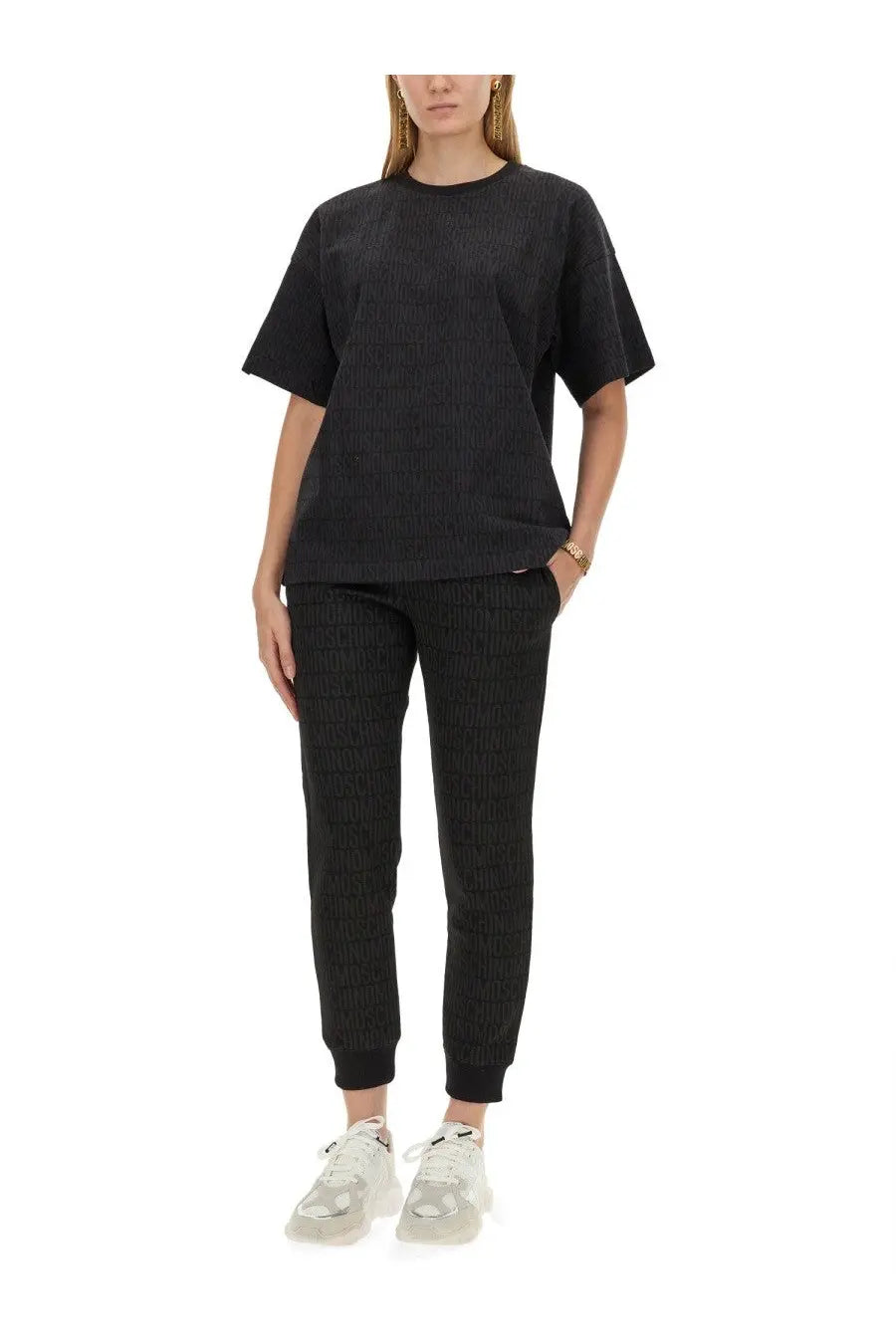 Moschino women’s black ribbed knit t-shirt with short sleeves and crew neckline in a close-up view