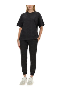 Moschino women’s black ribbed knit t-shirt with short sleeves and crew neckline in a close-up view
