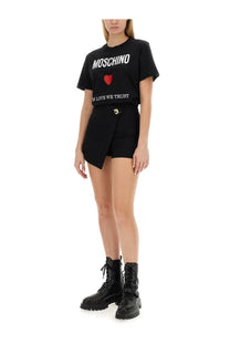 Moschino women’s black t-shirt with bold white lettering and red heart graphic on the front