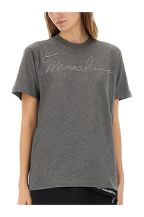 Gray heathered moschino women’s t-shirt with silver embroidered logo on front in soft cotton material