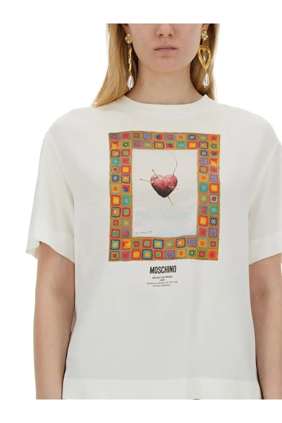 Off-white Moschino women’s white t-shirt with colorful framed graphic of knitted heart and knitting needles