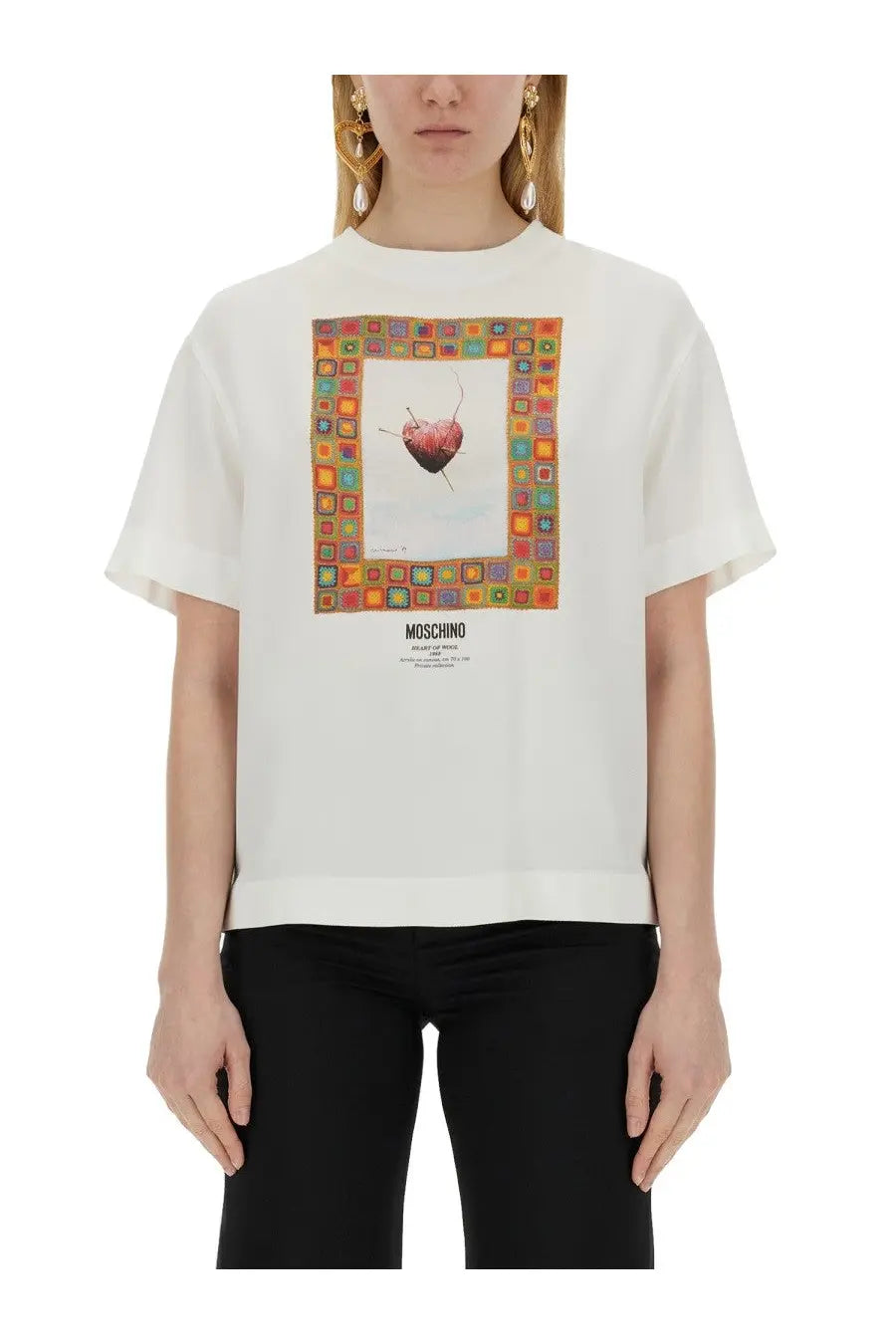White moschino women’s t-shirt with colorful framed heart graphic and brand name printed below on front