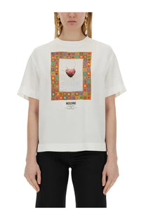 White moschino women’s t-shirt with colorful framed heart graphic and brand name printed below on front