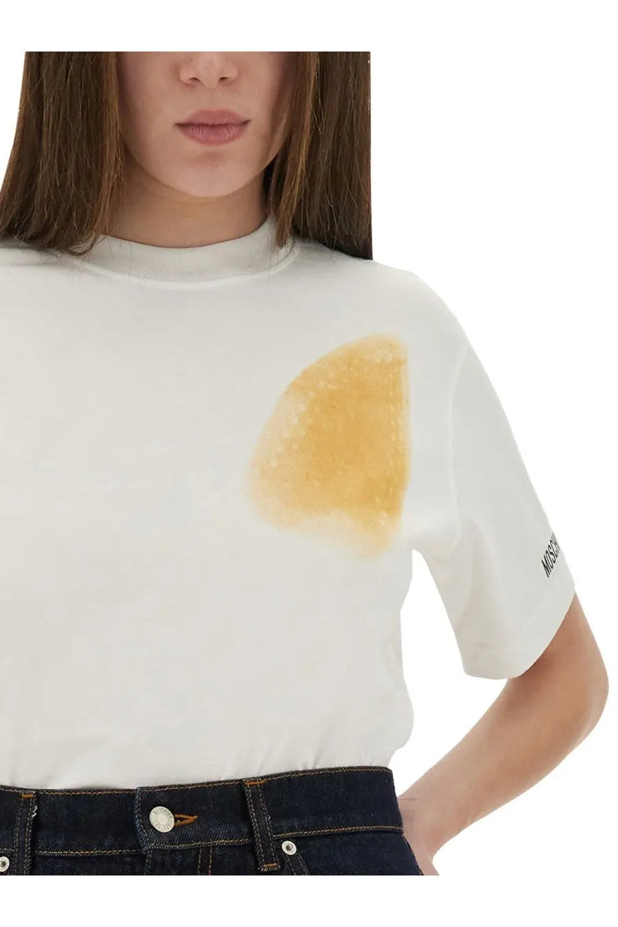Moschino women’s white short-sleeved shirt with yellowish-brown chest stain and small black logo on sleeve