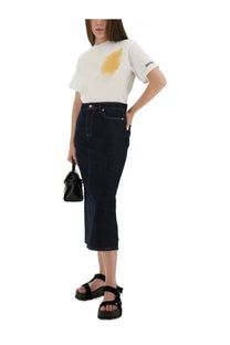 Moschino women’s white t-shirt with yellow stain design and branded sleeve detail for casual wear