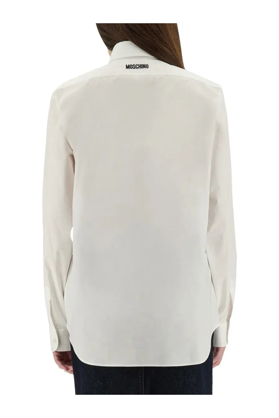 Moschino women’s cream-colored long-sleeved shirt with crisp collar and subtle branding at back neckline shown from back