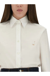 Moschino women’s cream-colored button-down shirt with a small embroidered stork on the left chest