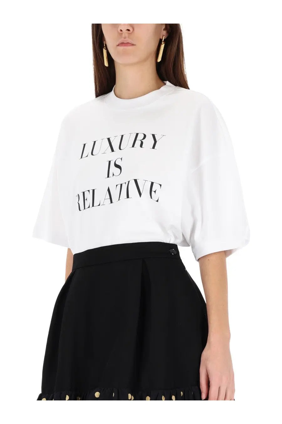 Moschino women’s white oversized t-shirt with black luxury is relative text printed across the chest