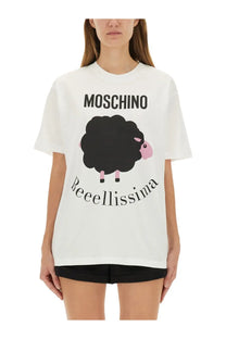 Moschino women’s white cotton t-shirt featuring a black sheep with pink face and legs above beeellissima text