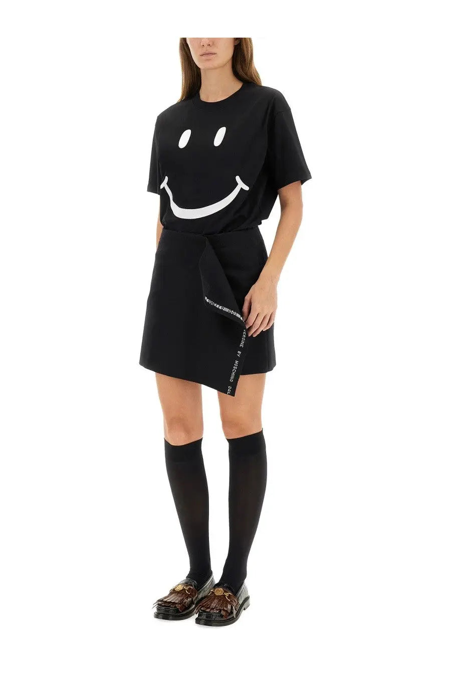 Moschino women’s black short-sleeved t-shirt with a large white smiley face graphic on the front