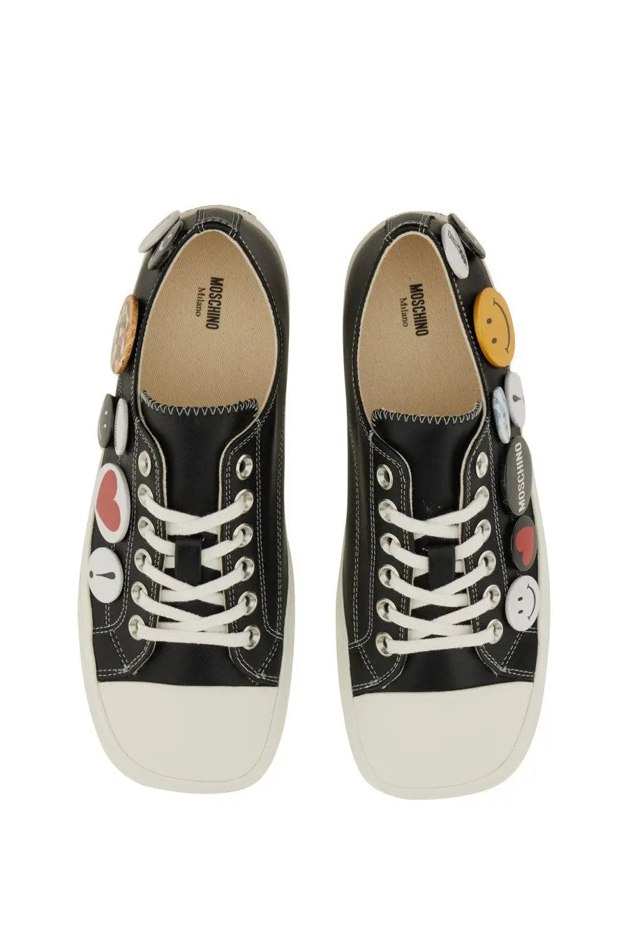 Moschino women’s black sneakers with white rubber soles and decorative smiley face and heart buttons