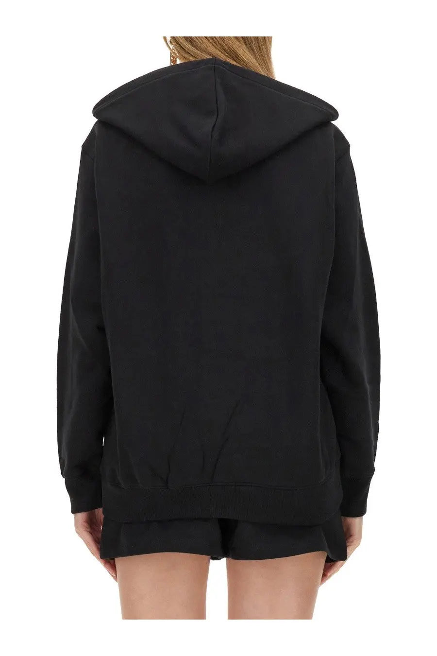 Moschino women’s black oversized hoodie with relaxed fit and ribbed cuffs made of soft sweat fabric