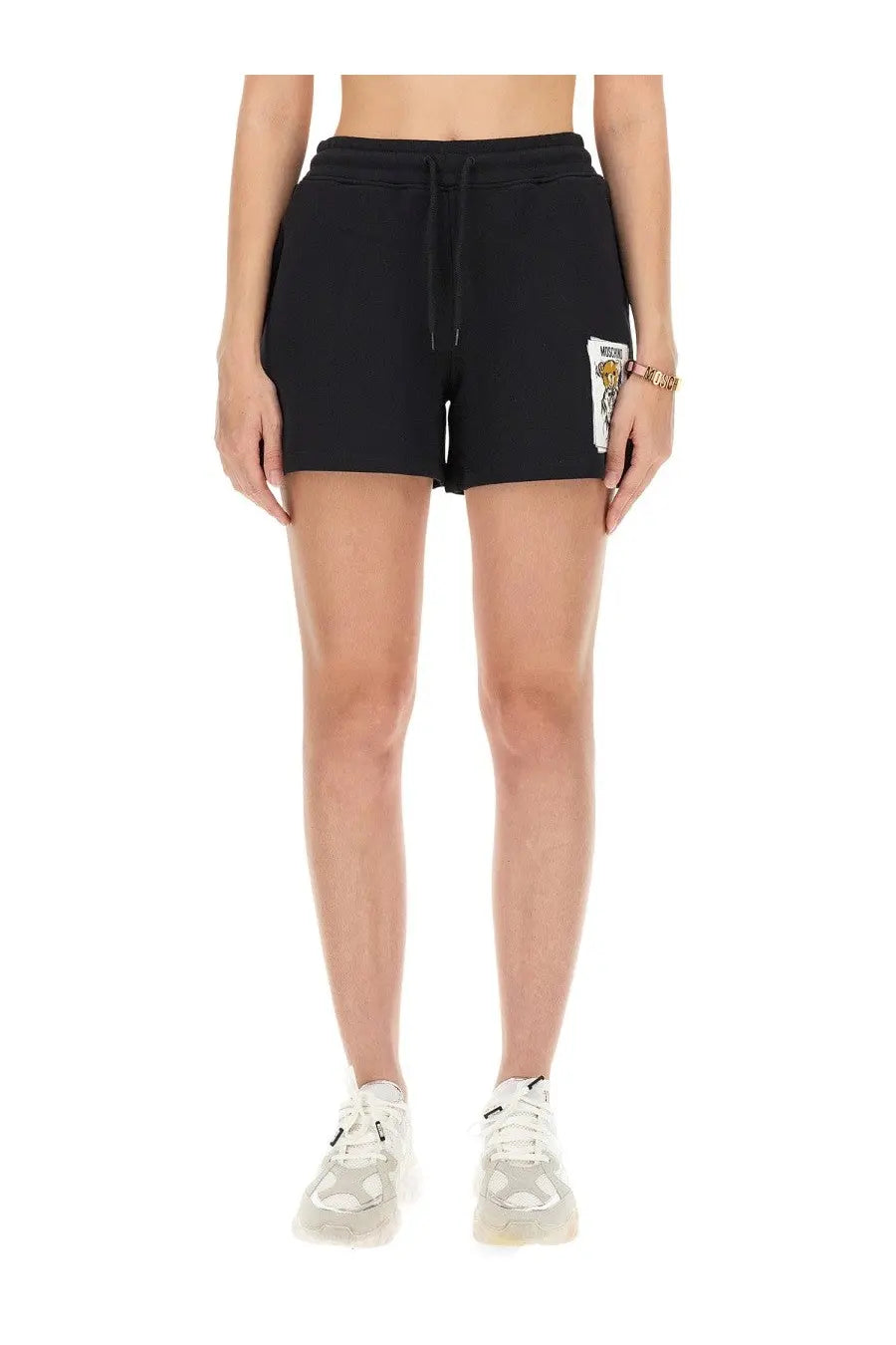 Moschino women’s black cotton sweatshirt shorts with drawstring waistband and white embroidered patch on left leg