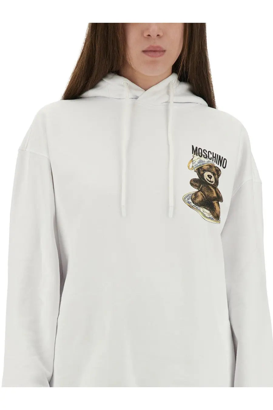 Moschino women’s white cotton sweatshirt with brown teddy bear wearing crown and sitting on skateboard graphic