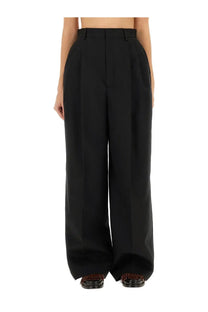 Moschino women’s black high-waisted wide-leg tailored pants with structured design perfect for formal wear