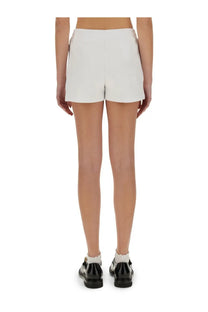 White tailored shorts by moschino with a clean minimalist design featuring teddy bear detailing